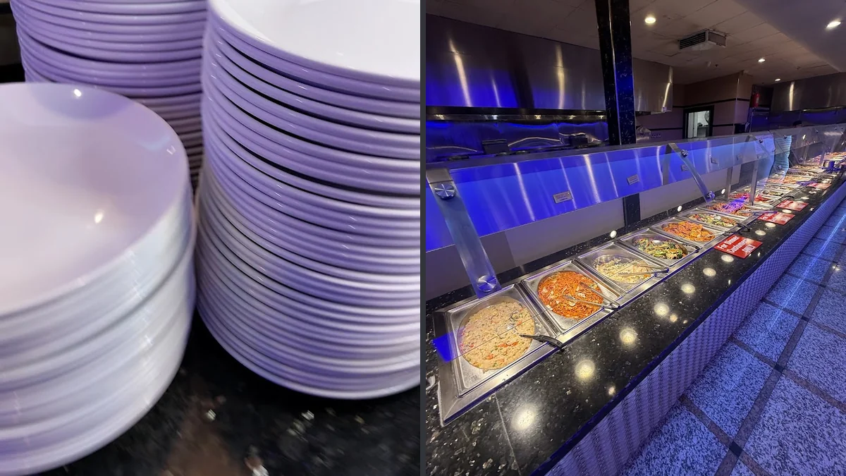 Buffet trays filled with seafood and hot dishes.