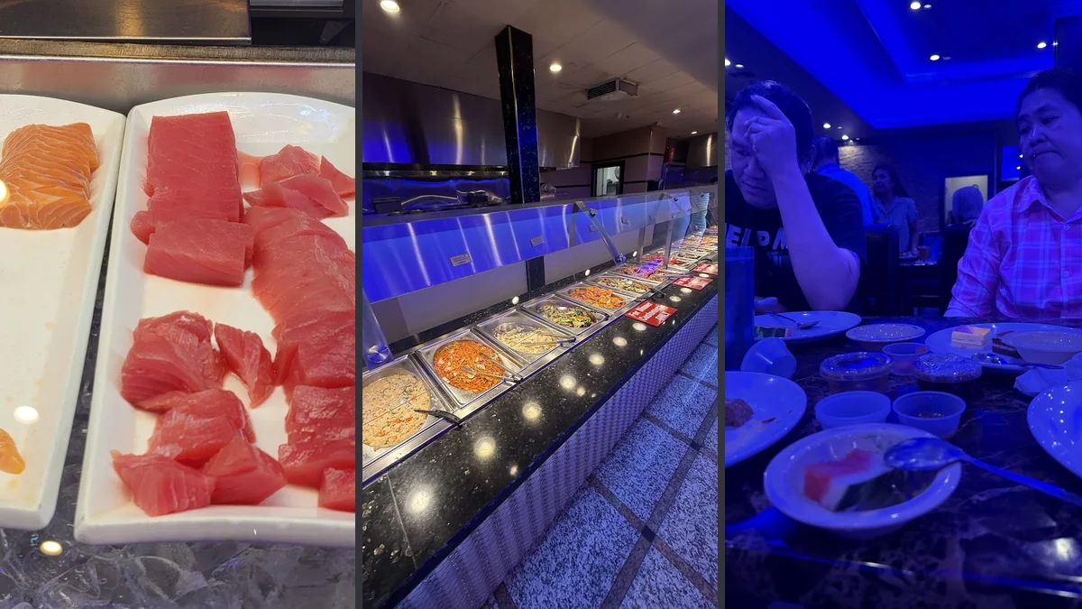 Buffet trays filled with seafood and hot dishes.