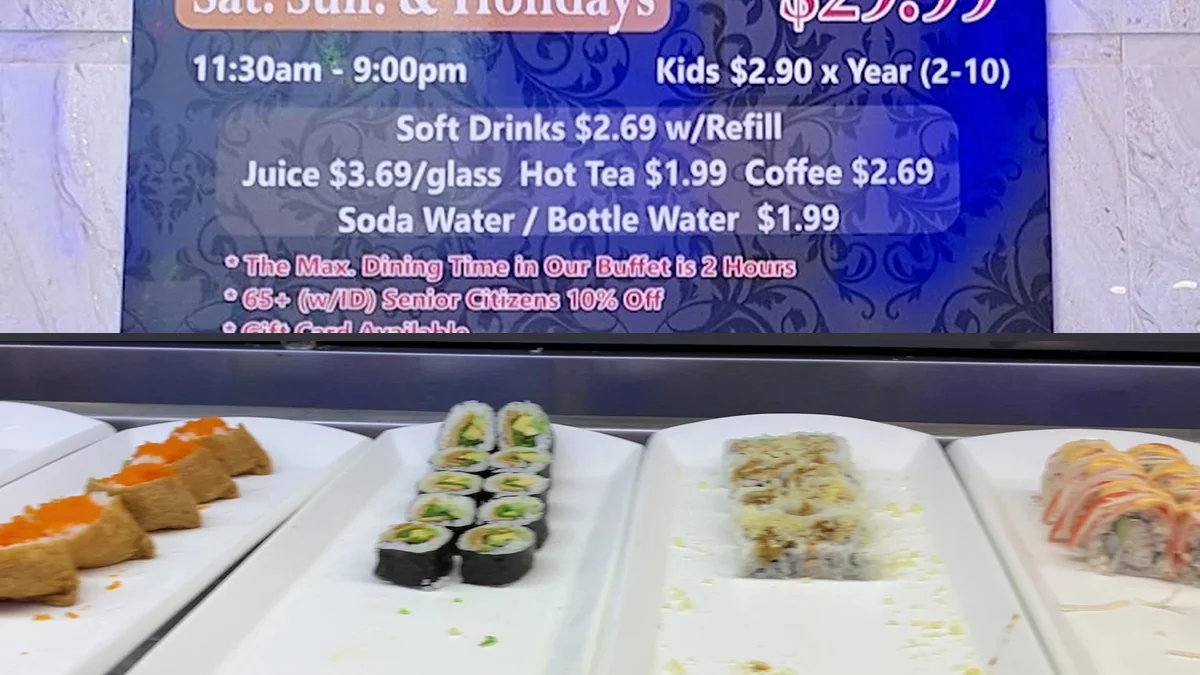 Buffet trays filled with seafood and hot dishes.